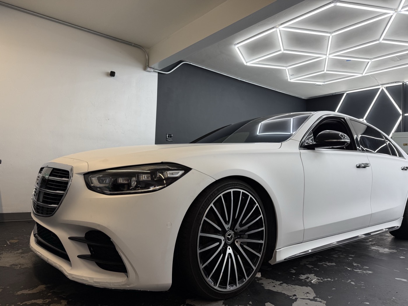 Satin white Mercedes S-Class wrapped by Obsidian Wrapz in their San Diego bay